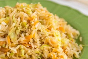 A green plate of cabbage fried rice
