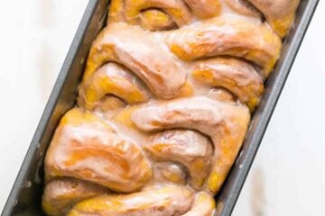 You'll make this Pumpkin Bread over and over. Cinnamon rolls + pumpkin pie + amazing cinnamon glaze = this pull-apart pumpkin bread! It melts in your mouth! | natashaskitchen.com