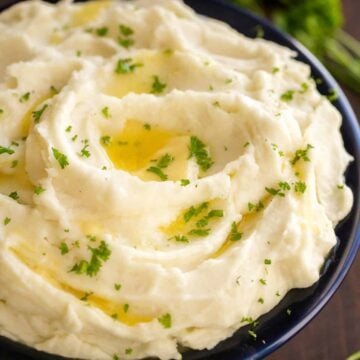 These creamy mashed potatoes are shockingly good! Learn the secrets to the best mashed potatoes recipe. Whipped, velvety and holiday worthy mashed potatoes! | natashaskitchen.com