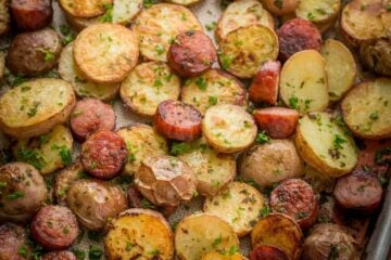 These roasted potatoes are ultra crispy and flavorful with a perfect browning on the coins of kielbasa. Easy, one-pan roasted potatoes and sausage recipe | natashaskitchen.com