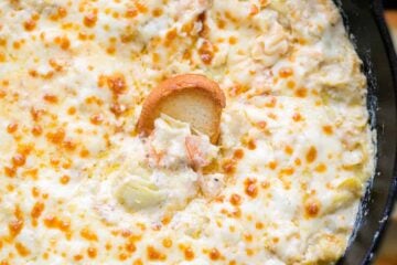 This Hot Shrimp Dip is the ultimate game day or party appetizer. It is creamy, cheesy and loaded with shrimp and artichokes.