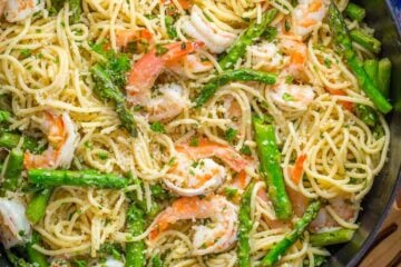 Shrimp Scampi Pasta with Asparagus has a lemon garlic and herb sauce that packs so much fresh and amazing flavor. A 30 minute shrimp scampi pasta recipe! | natashaskitchen.com