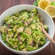 Avocado Tuna Salad Recipe in a white serving bowl with a serving spoon