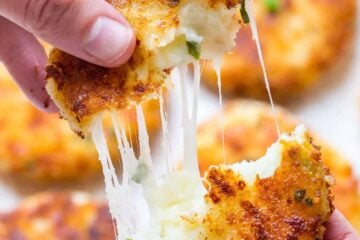 Cheesy mashed potato pancakes recipe - best way to use up leftover mashed potatoes! Mashed Potato Pancakes are crispy outside and loaded with melty cheese! | natashaskitchen.com