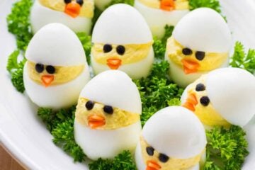 Easy and fun Easter Egg Recipe. A creative spin on traditional dressed eggs. Deviled egg chicks were the talk of my kitchen - the cutest Easter chicks! | natashaskitchen.com