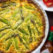 Every bite of this Sausage Asparagus Quiche is pure comfort. This classic quiche recipe is loaded with juicy sausage, eggs, fresh asparagus and herbs. | natashaskitchen.com