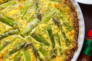 Every bite of this Sausage Asparagus Quiche is pure comfort. This classic quiche recipe is loaded with juicy sausage, eggs, fresh asparagus and herbs. | natashaskitchen.com