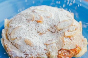 Easy Almond Croissants with crispy edges, crunchy nuts, and moist inside. Watch the video recipe for almond croissants. Melt-in-your-mouth delicious! | natashaskitchen.com