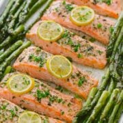 One-Pan Salmon Asparagus recipe with a lemon-garlic-herb butter. Every bite is so juicy and flavorful! A reader favorite, 20-minute salmon dinner. | natashaskitchen.com