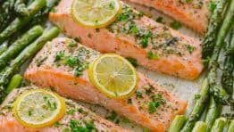 One-Pan Salmon Asparagus recipe with a lemon-garlic-herb butter. Every bite is so juicy and flavorful! A reader favorite, 20-minute salmon dinner. | natashaskitchen.com