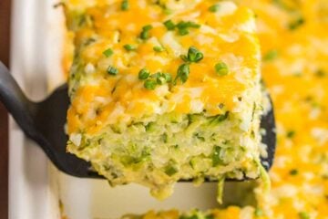 A golden cheesy crust seals in the fluffy, moist and creamy center of this zucchini casserole. An easy and irresistibly delicious zucchini casserole recipe | natashaskitchen.com