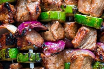 These grilled steak kebabs are juicy and mouthwatering-delicious! It marinates overnight which makes the steak kebabs tender and so flavorful. | natashaskitchen.com