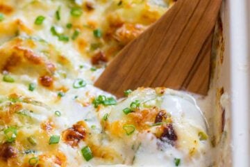 Creamy, cheesy Zucchini Potato Bake in a garlic Alfredo sauce. This potato bake recipe has simple ingredients, comes together quickly and tastes so good! | natashaskitchen.com