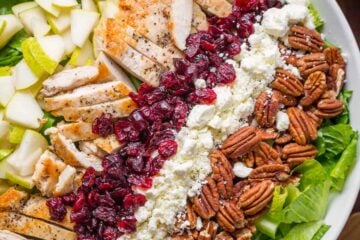 Autumn Chopped Chicken Salad will be your favorite Fall salad. Chicken Salad with pears, craisins, pecans, feta and chicken with easy balsamic vinaigrette! | natashaskitchen.com