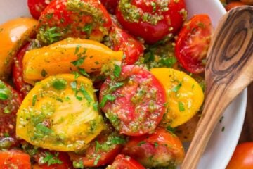 Easy marinated tomatoes recipe with so much flavor! Makes store-bought tomatoes taste WAY better! Marinated tomatoes keep well refrigerated up to 1 week | natashaskitchen.com