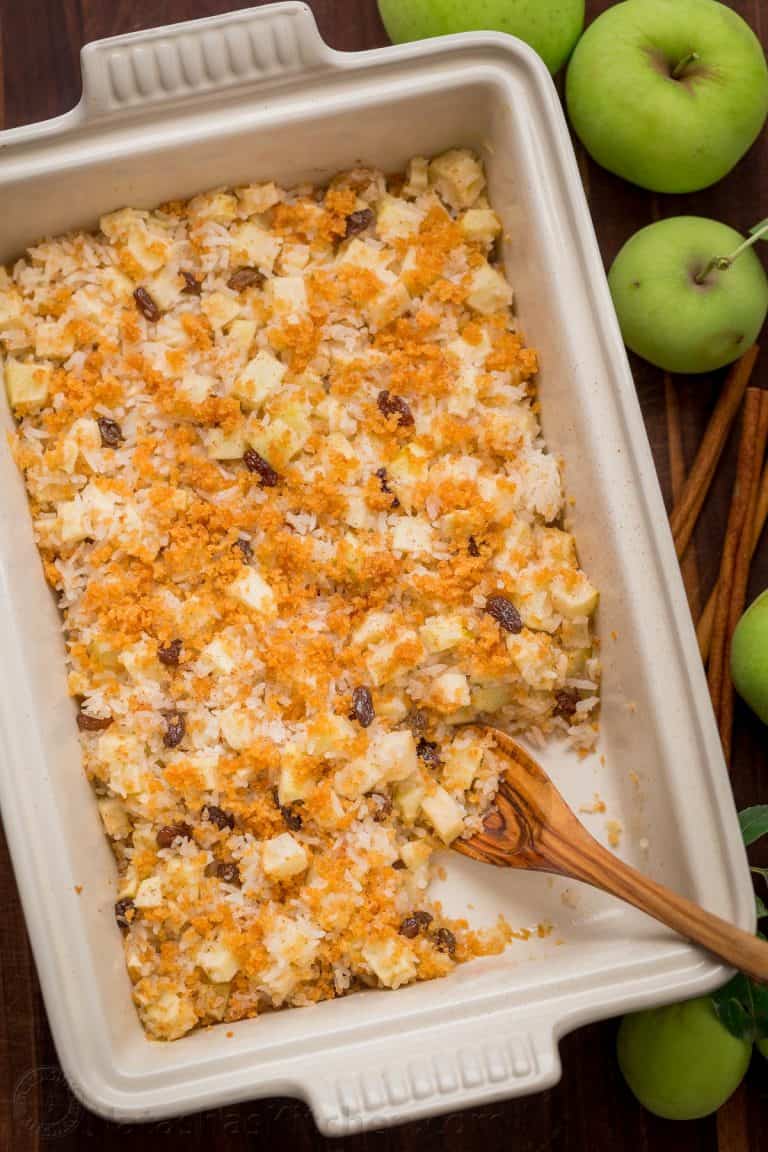 Apple rice pudding is Autumn comfort food. It is loaded with apples, cinnamon and a browned butter crunchy topping. A great way to use leftover white rice! | natashaskitchen.com