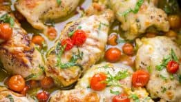 Pesto Chicken. Must-try Chicken Pesto Roll Ups! Stuffed with cheese, juicy tomatoes and pesto! Chicken Pesto Roll Ups taste like fine dining, but are so easy to make. | natashaskitchen.com