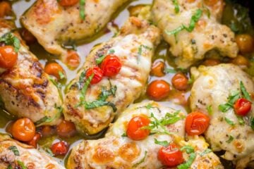 Pesto Chicken. Must-try Chicken Pesto Roll Ups! Stuffed with cheese, juicy tomatoes and pesto! Chicken Pesto Roll Ups taste like fine dining, but are so easy to make. | natashaskitchen.com