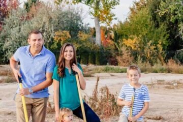 Natasha and family posing with shovels in hand