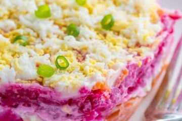 This Smoked Salmon Salad is our version of the classic Russian Shuba. This salmon layer salad is unique and absolutely delicious. WOW your dinner guests! | natashaskitchen.com