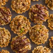 Mini Baklava Cups taste like authentic baklava but easier! The honey and lemon syrup make these baklava cups completely irresistible. A make-ahead recipe! | natashaskitchen.com