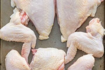 Cutting a whole chicken is easy! Video tutorial on how to cut up a whole chicken! Save money and use the carcass for the homemade chicken stock! | natashaskitchen.com