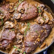 This pan-seared Filet Mignon recipe really is our go to recipe for filet mignon. Melt-in-your mouth tender and every bite is so flavorful in that mushroom wine cream sauce. Watch the video tutorial on how to cook the best filet mignon. | natashaskitchen.com