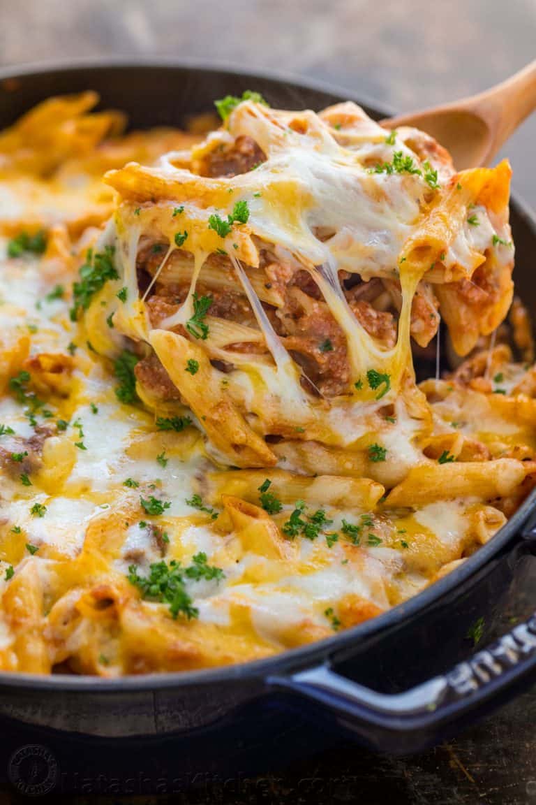 What is a lasagna casserole? This easy lasagna pasta bake has all the same elements of a classic lasagna, but the process is so easy! Everything is combined in a casserole dish (no layering) and this lasagna recipe bakes way faster! | natashaskitchen.com