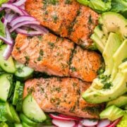 This avocado salmon salad recipe is loaded with all of the best salad ingredients; crisp cucumber and lettuce, and juicy pan seared salmon. The lemon dill dressing is so easy and gives this salmon salad amazing fresh flavor. | natashaskitchen.com