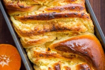 This Braided Easter Bread has the softest crumb. It is laced with farmer cheese and studded with apricots and orange zest which gives the entire loaf amazing flavor and aroma. Make this Easter Bread your new Easter tradition. This brings a cheese Paska and Classic Kulich together into 1 impressive Easter bread! | natashaskitchen.com