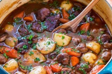 Classic lamb stew is loaded with hearty, healthy ingredients. This lamb stew recipe is simple (a one-pot meal!) and perfect for special occasions (think Easter!). Baking the stew in the oven makes the tender lamb morsels and root vegetables just melt in your mouth. Learn how to make traditional lamb stew. | natashaskitchen.com
