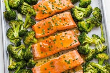 Apricot Dijon Salmon and Broccoli is an easy, excellent one-pan salmon meal. The sweet and savory apricot glaze seals in the juices of the salmon making it moist and flaky. You will enjoy every bite of this apricot glazed salmon. Learn: What is the difference between wild caught and farmed salmon