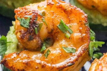 These shrimp appetizers have plump juicy cajun shrimp over creamy avocado on a crisp slice of cucumber. These shrimp cucumber bites are a delicious mouthful!