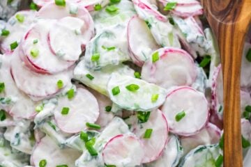 Creamy cucumber radish salad in a white bowl