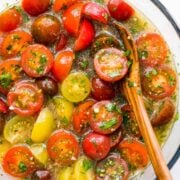 Marinated cherry tomatoes are a colorful, juicy and tasty side dish that is perfect for summer parties, buffets and large gatherings because it can be made hours in advance. This is one of our favorite cherry tomato recipes! Italian marinated tomatoes with just 4 ingredients! | natashaskitchen.com