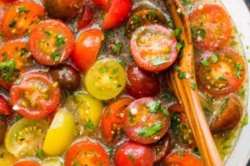 Marinated cherry tomatoes are a colorful, juicy and tasty side dish that is perfect for summer parties, buffets and large gatherings because it can be made hours in advance. This is one of our favorite cherry tomato recipes! Italian marinated tomatoes with just 4 ingredients! | natashaskitchen.com