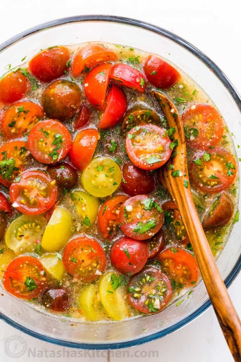 Marinated cherry tomatoes are a colorful, juicy and tasty side dish that is perfect for summer parties, buffets and large gatherings because it can be made hours in advance. This is one of our favorite cherry tomato recipes! Italian marinated tomatoes with just 4 ingredients! | natashaskitchen.com