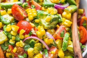Avocado Corn Salad in a Serving bowl with Spoon