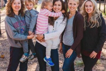 Four women two of which are holding children