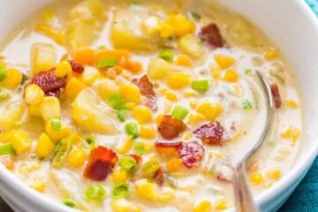 Bacon Corn Chowder in a white bowl garnished with bacon