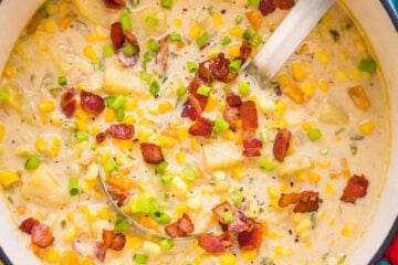 Corn chowder in soup pot with ladle
