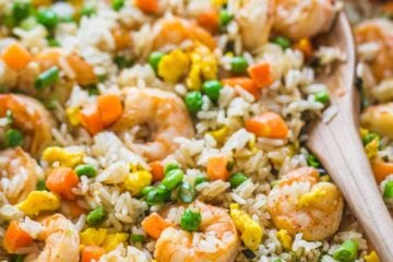 Shrimp fried rice in skillet with spatula