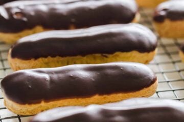 You haven't enjoyed an Eclair until you've tried a fresh homemade eclair! Learn how to make Eclairs with choux pastry, pastry cream and chocolate ganache. | natashaskitchen.com