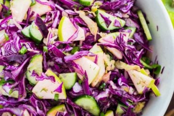 My Sister Alla's Red Cabbage Salad with Apple is loaded with the best Autumn Ingredients. She sneaks sauerkraut into her salad, making it like a red cabbage slaw. One of our Favorite Red Cabbage Recipes! | natashaskitchen.com