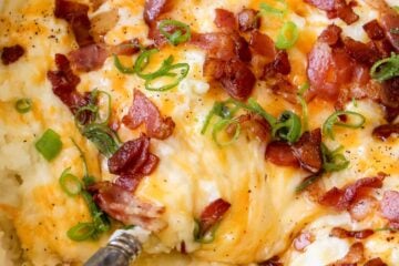 Loaded Mashed Potato Casserole is the perfect side dish. These irresistibly creamy baked mashed potatoes are loaded with cheese and topped with crispy bacon.