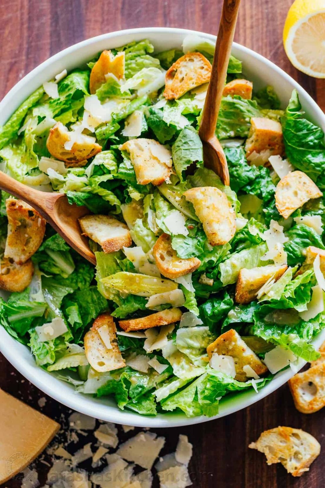 caesar salad with serving spoons