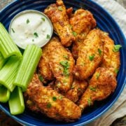 Air Fryer Chicken Wings served with celery sticks and dipping sauce