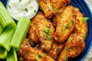 Air Fryer Chicken Wings served with celery sticks and dipping sauce