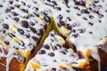 Ricotta cake slice being removed from cake