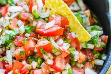 Pico De gallo in a serving bowl with tortilla chips